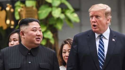 U.S. President Donald Trump walks with North Korean leader Kim Jong Un during a break in talks at the U.S.-North Korea summit in Hanoi on February 28, 2019.