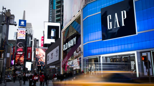 Pedestrians walk past Gap Inc. and Old Navy Inc. in the Times Square area of ​​New York City.