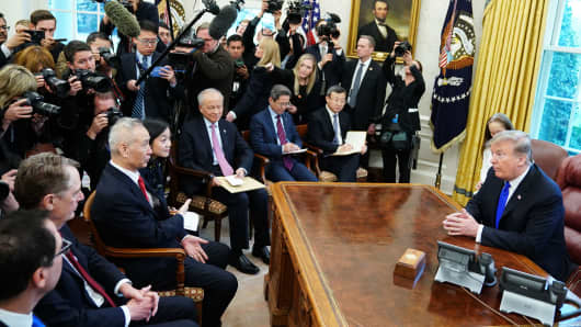 China's Vice Premier Liu He (3rd L) speaks during a meeting with US President Donald Trump in the Oval Office of the White House in Washington, DC on February 22, 2019.