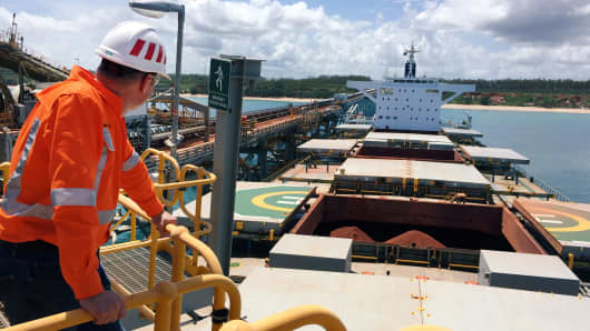 A Rio Tinto worker looks at a ship that is loaded with bauxite, the raw material for aluminum, at Rio Tinto's Weipa operations in Cape York, on the north-eastern tip of Australia March 7, 2019.