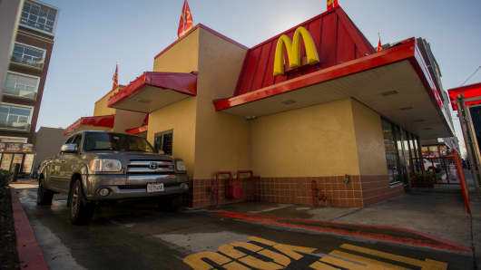   A customer is waiting for an order at the station through a McDonald's Corp. restaurant in San Pablo, California. 
