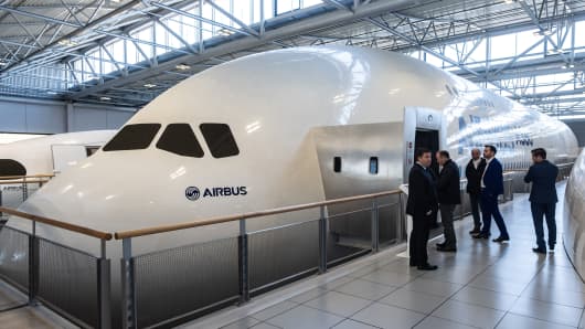 Visitors inspect a model Airbus SE A380 aircraft in an exhibition center at the aircraft maker's factory in Toulouse, France, on Wednesday, March 20, 2019.  Photographer: Balint Porneczi/Bloomberg via Getty Images