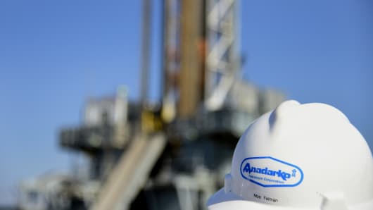 The logo of Anadarko Petroleum Corp. appears on the helmet of a contractor installed on the site of the company's oil rig in Fort Lupton, Colorado.