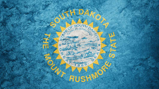 Grunge South Dakota state flag. South Dakota flag background grunge texture.
