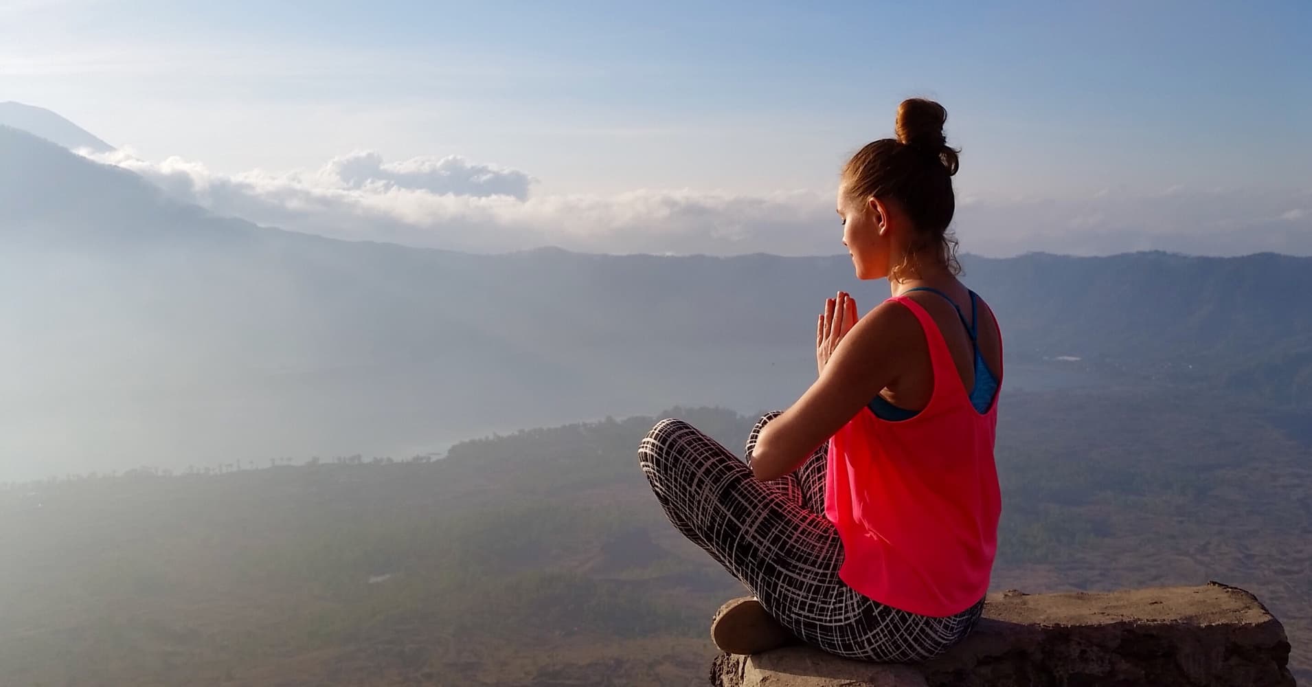 Meditation at the sunrise at the top of mount Batur in Bali, Indonesia