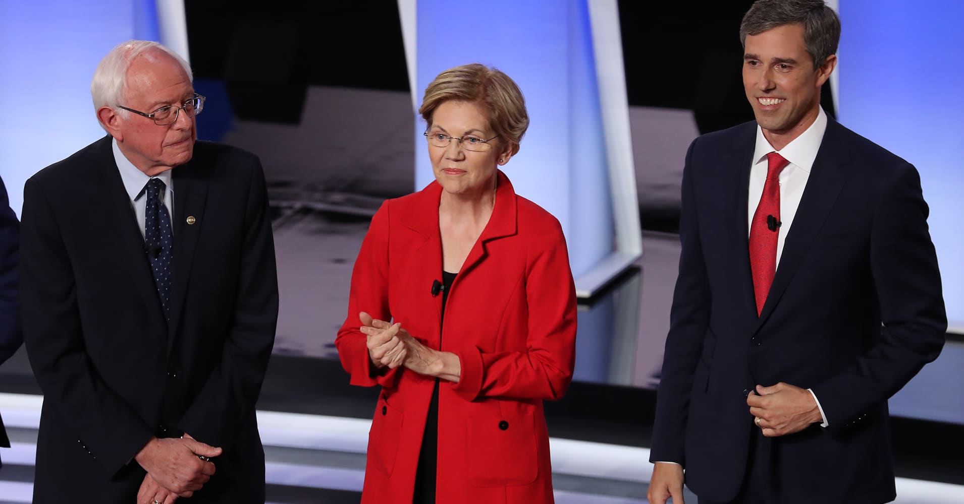Democratic presidential candidates former Texas congressman Beto O'Rourke (left), Sen. Elizabeth Warren (D-Mass.), and Sen. Bernie Sanders (I-Vt.) take the stage at the Democratic Presidential Debate in Detroit, Michigan.